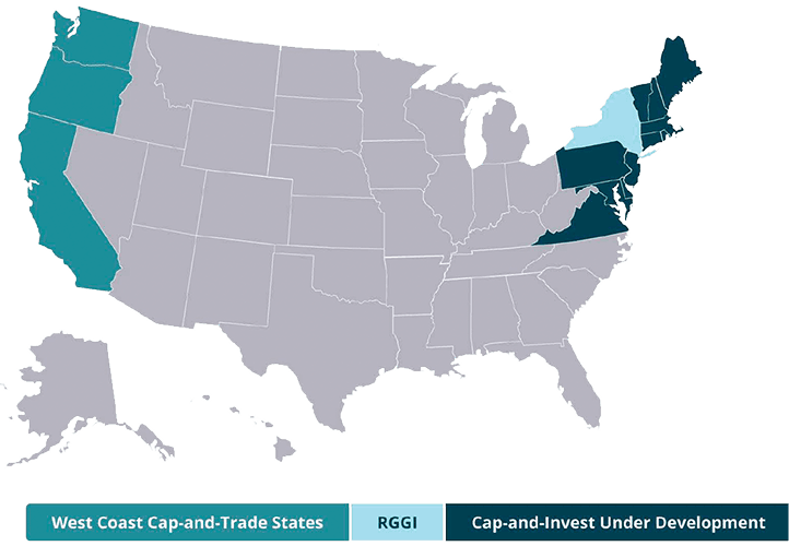 U.S. map showing state participation in carbon pricing programs. States along the West Coast—California, Oregon, and Washington—are highlighted in teal to represent active cap‑and‑trade programs. Several states in the Northeast, including those in the Regional Greenhouse Gas Initiative (RGGI), are shown in light blue. New York appears in dark teal to indicate a cap‑and‑invest program under development. All other states are shown in gray, indicating no current cap‑and‑trade or cap‑and‑invest system. The map visually summarizes where carbon pricing mechanisms are active or emerging across the United States.